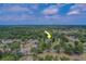 Picturesque aerial view of a home surrounded by lush greenery in a charming neighborhood setting at 4004 Se 47Th Pl, Ocala, FL 34480