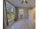 Bedroom featuring a large window and a view of the closet and door at 4004 Se 47Th Pl, Ocala, FL 34480