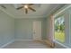 Inviting bedroom with tray ceiling, ample natural light, and calming paint at 4004 Se 47Th Pl, Ocala, FL 34480