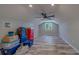 Upstairs bonus room with recessed lighting, ceiling fan, laminate floors, and large window at 4004 Se 47Th Pl, Ocala, FL 34480