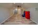 Upstairs bonus room features laminate flooring, recessed lighting, ceiling fan, and white trim at 4004 Se 47Th Pl, Ocala, FL 34480
