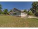Stylish home exterior with green siding, stone accents, and well-manicured lawn at 4004 Se 47Th Pl, Ocala, FL 34480