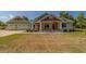 Charming single-Gathering home with a welcoming front porch and a spacious two-car garage at 4004 Se 47Th Pl, Ocala, FL 34480