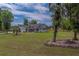 Spacious home on a large lot with mature trees and green lawn at 4004 Se 47Th Pl, Ocala, FL 34480