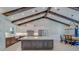 Stunning kitchen and dining area features an island and dark wood ceiling beams at 4004 Se 47Th Pl, Ocala, FL 34480
