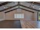 Bright living room features vaulted ceilings, wooden beams, recessed lighting and ceiling fans at 4004 Se 47Th Pl, Ocala, FL 34480