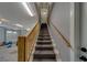 Carpeted staircase leading from the garage to the main level of the home at 4004 Se 47Th Pl, Ocala, FL 34480