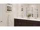 Bathroom featuring double vanity, framed art, and modern shower at 4723 Golden Knight Blvd, Kissimmee, FL 34746