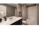 Elegant bathroom with a shower-tub combo, quartz countertops, and modern fixtures at 4723 Golden Knight Blvd, Kissimmee, FL 34746