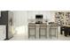 Modern kitchen with white cabinetry, stainless steel appliances, island seating and stylish decor, perfect for cooking and entertaining at 4838 Waltham Forest Dr, Davenport, FL 33837