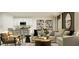 Stylish living area with modern furniture and decor, flowing into kitchen, perfect for relaxation and entertaining guests at 4838 Waltham Forest Dr, Davenport, FL 33837