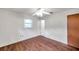 Minimalist bedroom with wood floors, a standard closet, and bright natural light at 1123 Enchanted Dr, Lakeland, FL 33801