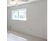 The bedroom features a bright window providing natural light, complemented by neutral colored walls at 1123 Enchanted Dr, Lakeland, FL 33801