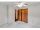 Bedroom features a standard closet and doorways, all with plush carpeting and a ceiling fan at 1123 Enchanted Dr, Lakeland, FL 33801