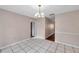 Bright dining room showcasing tile flooring and a decorative chandelier at 1123 Enchanted Dr, Lakeland, FL 33801