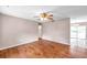 Open-concept living room with hardwood floors leading to dining area at 1123 Enchanted Dr, Lakeland, FL 33801