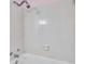This is a standard shower with white tiled walls and chrome fixtures at 1123 Enchanted Dr, Lakeland, FL 33801