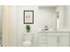 Clean bathroom with neutral colors, a modern vanity, and shower with curtain at 1393 Acorn Meadow Loop, Eustis, FL 32726