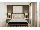 Bright bedroom featuring neutral tones, an abstract art piece, and modern nightstands at 1393 Acorn Meadow Loop, Eustis, FL 32726