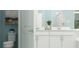 Beautifully designed bathroom with double vanity, modern fixtures, and tiled shower at 2155 Rider Rain Ln, Apopka, FL 32703