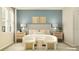 Inviting bedroom with stylish decor, bedside tables, and comfortable seating area for relaxing at 2155 Rider Rain Ln, Apopka, FL 32703
