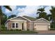 Inviting single-story home featuring stone accents, neutral colors, well-manicured lawn, and an attached two-car garage at 2155 Rider Rain Ln, Apopka, FL 32703