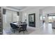 Elegant dining room area with a wood table, comfortable seating, and abundant natural light at 2275 Rider Rain Ln, Apopka, FL 32703