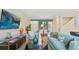 Open-concept living room flows into dining area, with stylish decor at 2301 White Buffalo St, Apopka, FL 32703