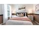 Cozy bedroom featuring a comfortable bed, stylish decor, and plenty of natural light at 2329 White Buffalo St, Apopka, FL 32703