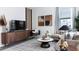 Modern living room features stylish furniture, sleek decor, and entertainment center at 2329 White Buffalo St, Apopka, FL 32703