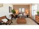 Cozy living room with neutral colors, comfortable seating, and tasteful decorations at 2329 White Buffalo St, Apopka, FL 32703