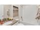 Clean bathroom with a tub, white subway tile, and a modern vanity at 2853 Haze Rd, Clermont, FL 34714