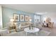Bright living room with stylish decor, a comfortable sofa, and an adjacent dining area at 2853 Haze Rd, Clermont, FL 34714