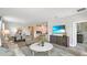 Cozy living room with modern furniture, wood-look tile flooring, and an open layout at 2853 Haze Rd, Clermont, FL 34714