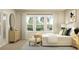 Cozy bedroom featuring a bed, natural light from large windows, and stylish décor at 2899 Transformation Way, Clermont, FL 34714