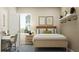 Cozy bedroom featuring a comfortable bed, a modern desk area, and natural lighting at 2899 Transformation Way, Clermont, FL 34714