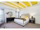 Elegantly decorated bedroom with a luxurious bed, chic lighting, and a mirrored wall accent at 3001 Namaste Dr, Clermont, FL 34714