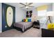 A stylish bedroom featuring surf decor, comfortable bed, and contemporary furnishings at 3001 Namaste Dr, Clermont, FL 34714