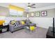 Relaxing bonus room featuring a comfortable sectional sofa, TV, and colorful artwork at 3001 Namaste Dr, Clermont, FL 34714
