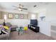 Cozy bonus room with a comfortable couch, TV, and playful decor at 3001 Namaste Dr, Clermont, FL 34714