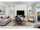 Inviting living room with neutral tones, stylish furnishings, and ample natural light at 3001 Namaste Dr, Clermont, FL 34714