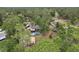 Aerial view of the property featuring lush tree coverage, pool, and RV parking at 3807 Timberlake N Rd, Lakeland, FL 33810