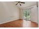 Bedroom featuring a ceiling fan and sliding glass doors providing ample natural light at 3807 Timberlake N Rd, Lakeland, FL 33810