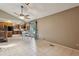 Dining area with tile floors adjacent to a kitchen and a sliding glass door at 3807 Timberlake N Rd, Lakeland, FL 33810