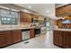 Bright kitchen with stainless steel appliances and cozy dining area with a fireplace at 3807 Timberlake N Rd, Lakeland, FL 33810