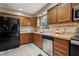 The home features a spacious kitchen including stainless steel appliances and bright tile floors at 3807 Timberlake N Rd, Lakeland, FL 33810