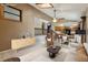 Open-concept living area with modern furnishings, a staircase, dining area and an adjacent kitchen at 3807 Timberlake N Rd, Lakeland, FL 33810