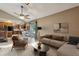 Inviting living area with a sectional sofa, modern decor, a dining area, and access to the kitchen at 3807 Timberlake N Rd, Lakeland, FL 33810