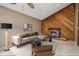 Cozy living room features a decorative fireplace, a sectional sofa, and stylish decor at 3807 Timberlake N Rd, Lakeland, FL 33810