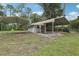 Outbuilding featuring dual carports, providing ample covered parking or storage on a spacious lot at 3807 Timberlake N Rd, Lakeland, FL 33810